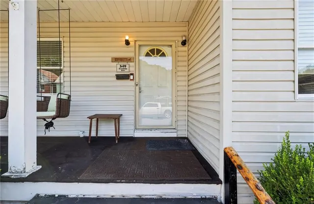 a view of front door and potted plants