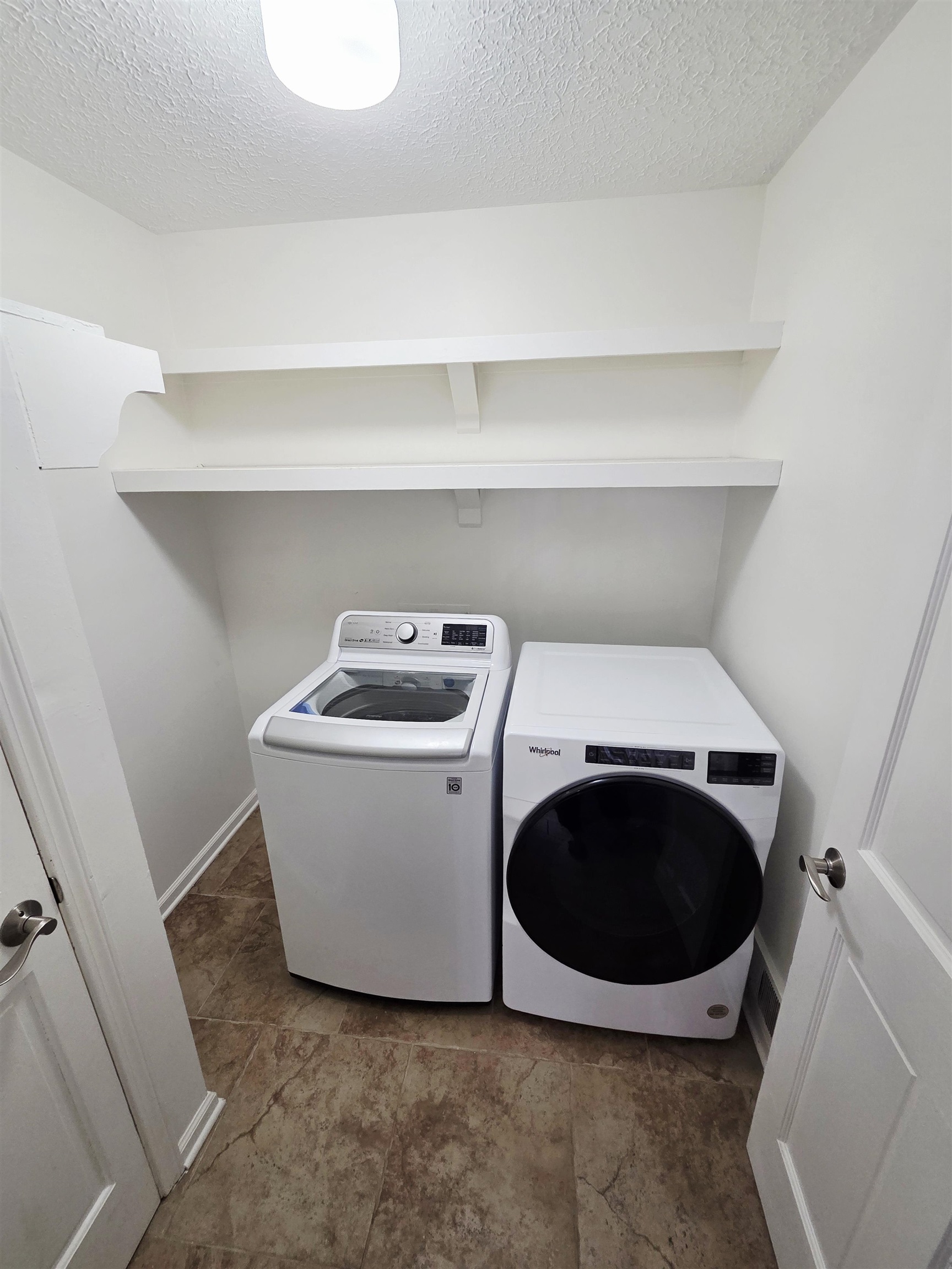 2095 Newfields Road Germantown, TN 38139 - Photo 13 of 34 Laundry area with washing machine and dryer and a textured ceiling