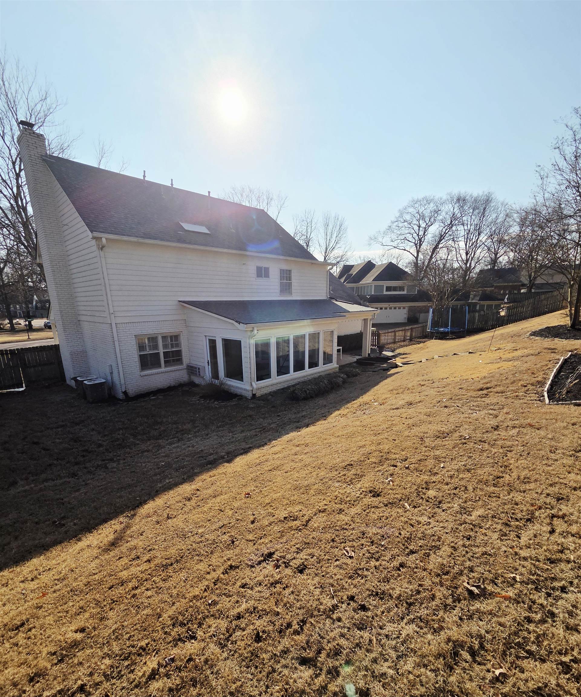2095 Newfields Road Germantown, TN 38139 - Photo 15 of 34 Rear view of house with a chimney and a patio
