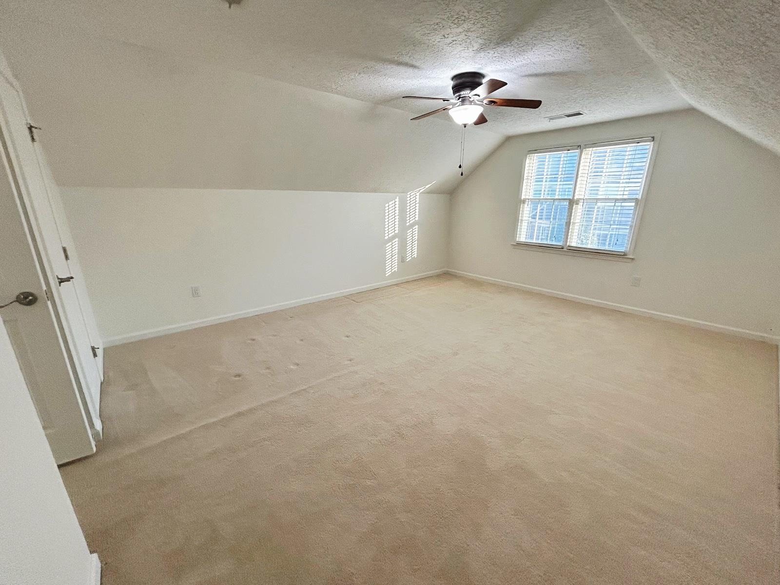 2095 Newfields Road Germantown, TN 38139 - Photo 28 of 34 Bonus room with a textured ceiling, ceiling fan, and light carpet