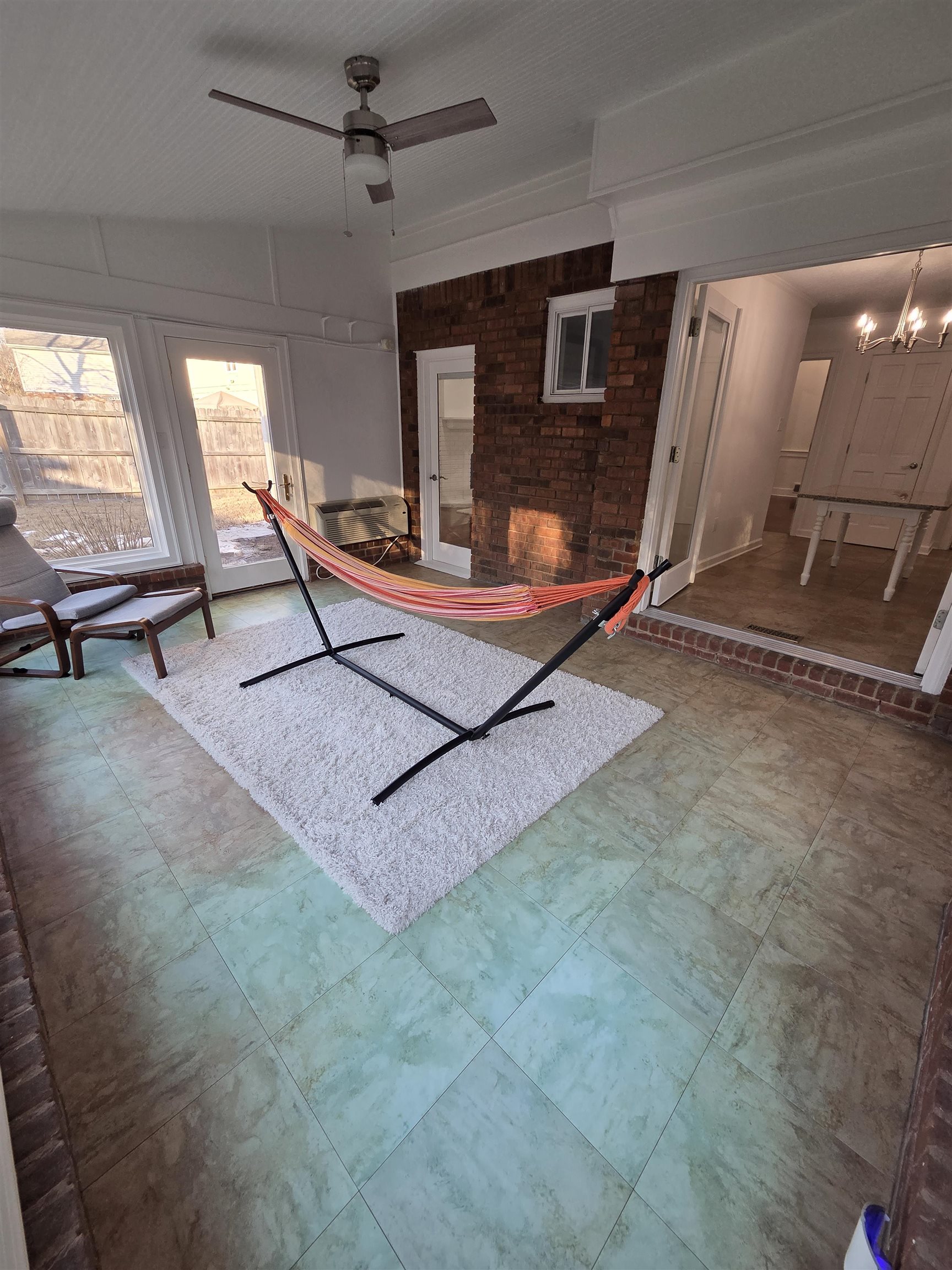 2095 Newfields Road Germantown, TN 38139 - Photo 34 of 34 Unfurnished living room featuring ceiling fan, tile patterned floors, and hanging lights