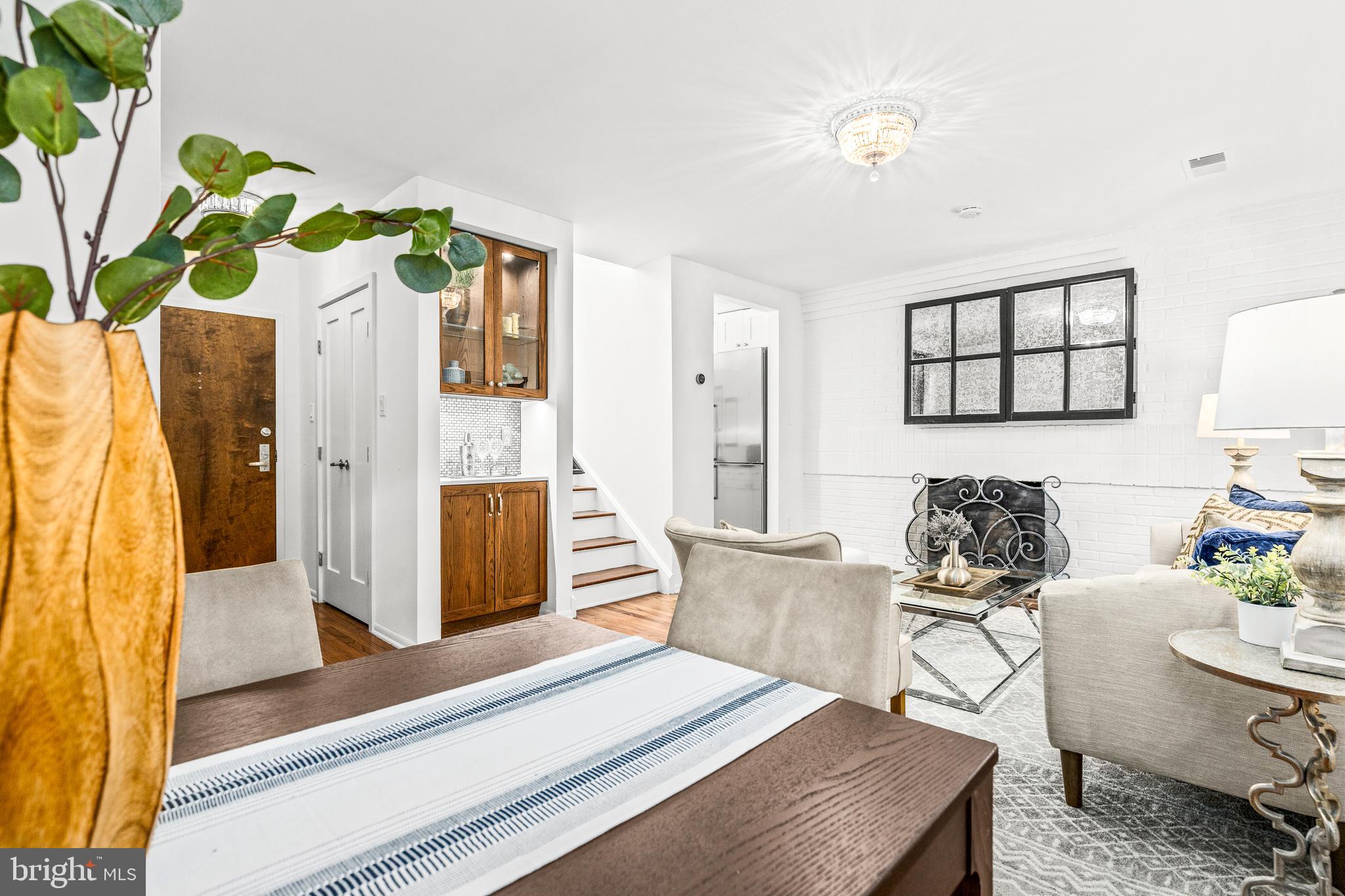 1730 16th Street Northwest, Unit 14 Washington, DC 20009 - Photo 11 of 30 a living room with furniture and a window