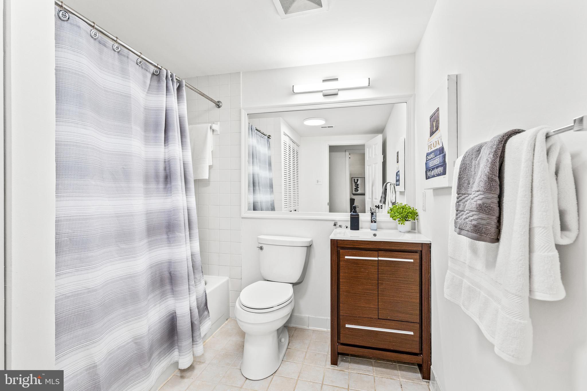 1730 16th Street Northwest, Unit 14 Washington, DC 20009 - Photo 24 of 30 a bathroom with a sink a toilet and shower