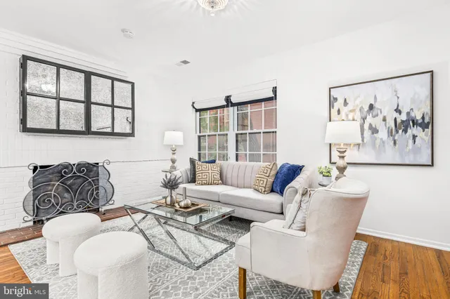 a living room with furniture a couch and a table