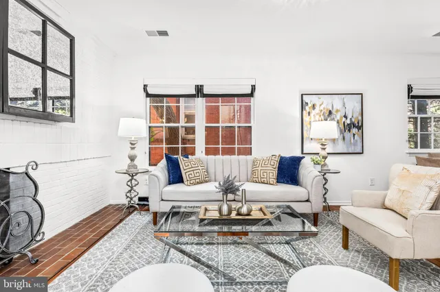 a living room with furniture and a table