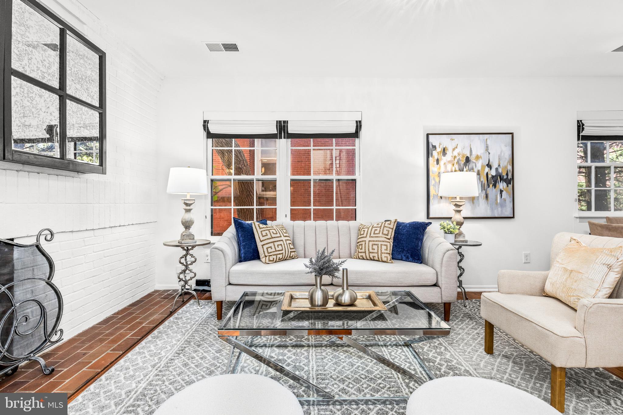1730 16th Street Northwest, Unit 14 Washington, DC 20009 - Photo 6 of 30 a living room with furniture and a table