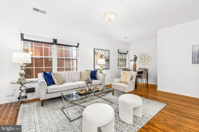 a living room with furniture and a rug