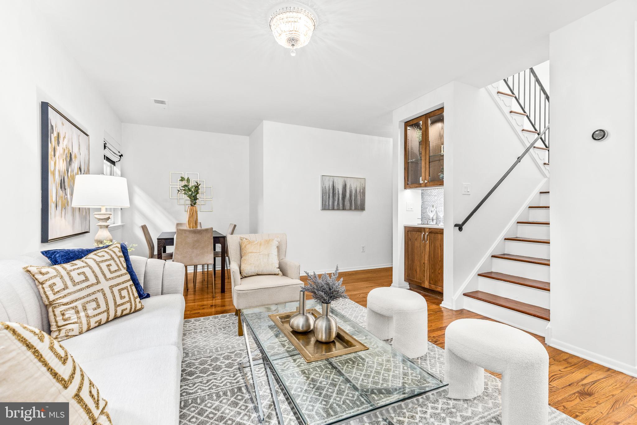 1730 16th Street Northwest, Unit 14 Washington, DC 20009 - Photo 8 of 30 a living room with furniture and wooden floor