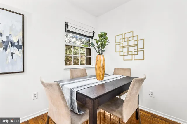 a view of a dining room with furniture and window