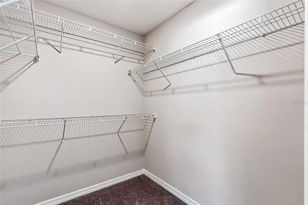 a view of a room with racks on the wall