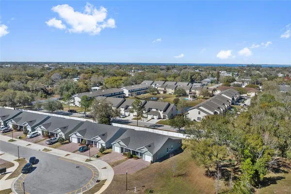 an aerial view of a house with a swimming pool