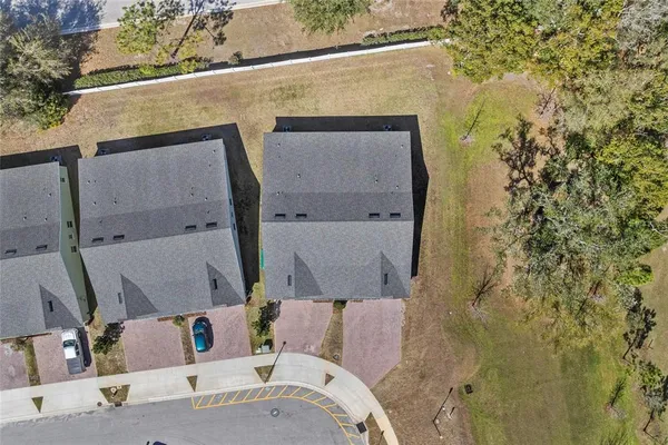 view of rooftop and yard