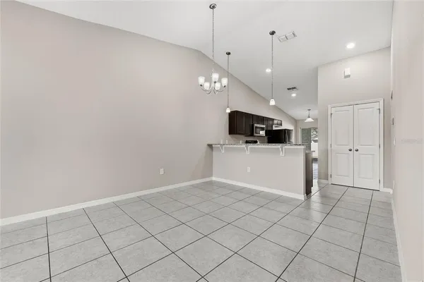 a view of a kitchen with microwave and cabinets