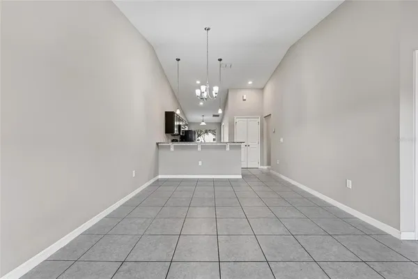 a view of a kitchen with a sink and dishwasher cabinets