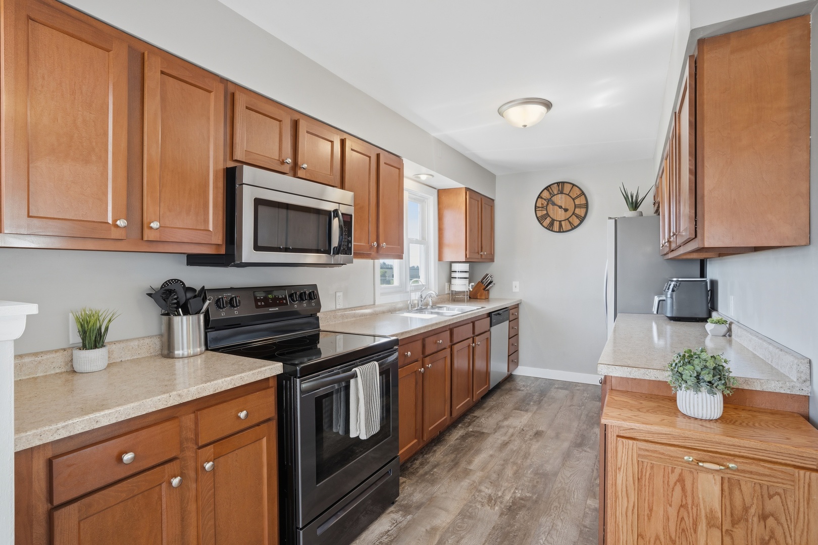 215 North Yates Street Alpha, IL 61413 - Photo 13 of 24 a kitchen with stainless steel appliances granite countertop a stove a sink and a microwave