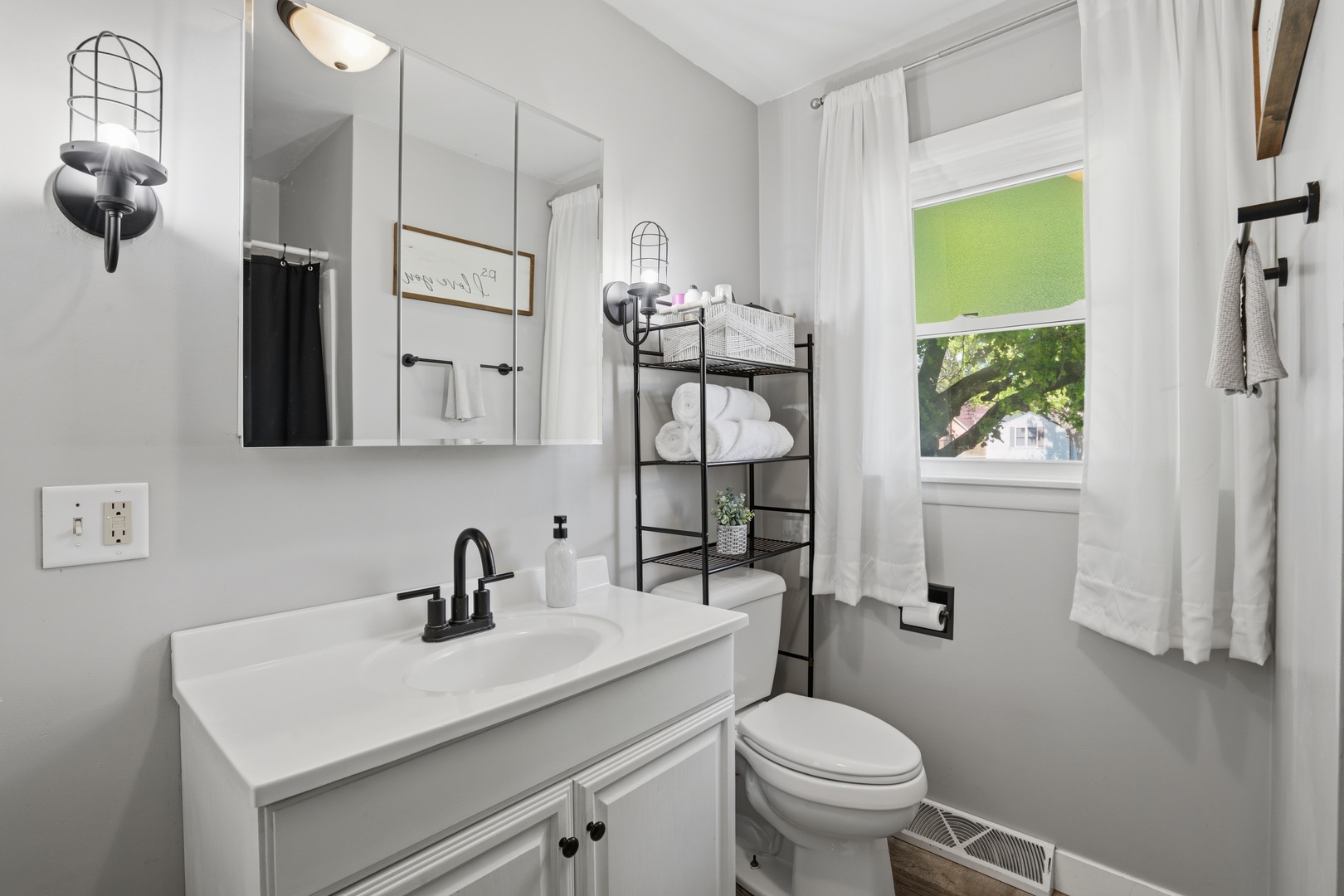 215 North Yates Street Alpha, IL 61413 - Photo 17 of 24 a bathroom with a sink a toilet and a mirror