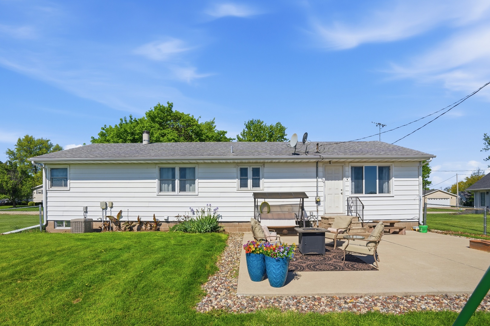 215 North Yates Street Alpha, IL 61413 - Photo 2 of 24 a view of a house with backyard sitting area and garden