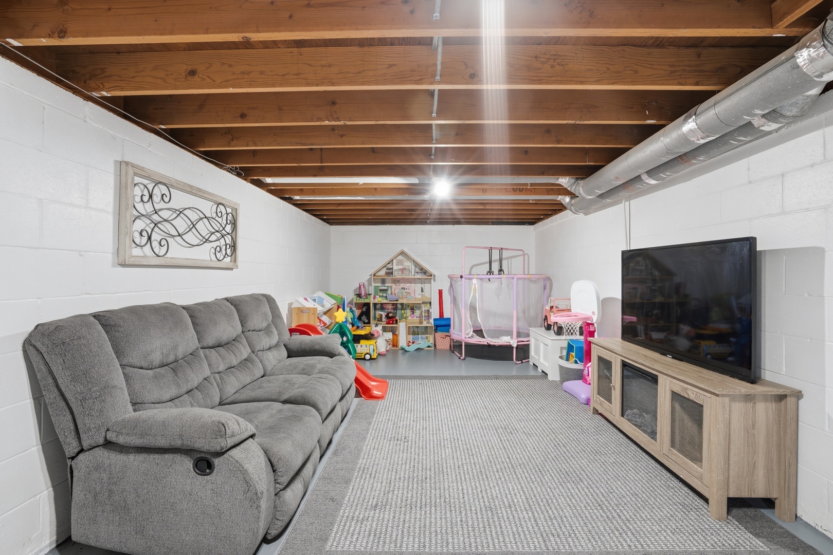 215 North Yates Street Alpha, IL 61413 - Photo 24 of 24 a living room with furniture and a flat screen tv