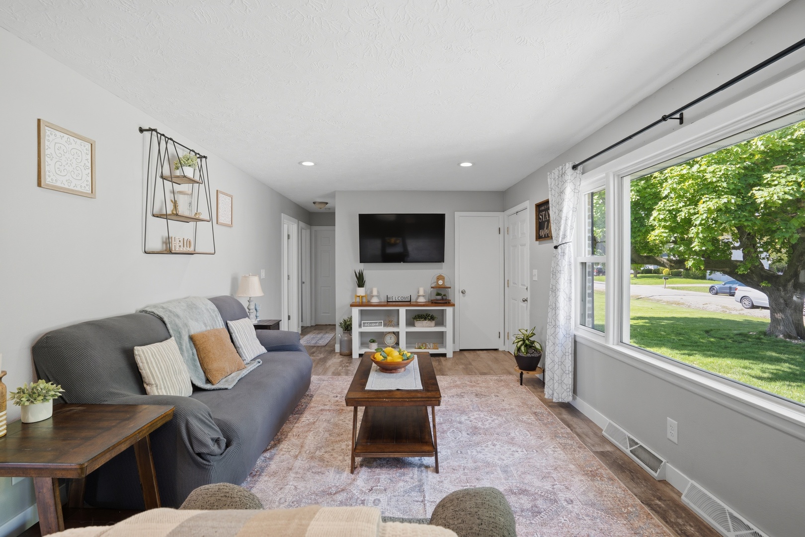 215 North Yates Street Alpha, IL 61413 - Photo 7 of 24 a living room with furniture fireplace and a large window
