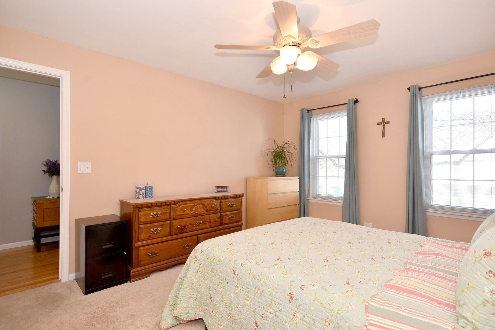1622 Hadley Court, Unit C1 Wheeling, IL 60090 - Photo 11 of 32 a bedroom with a bed and dresser with mirror