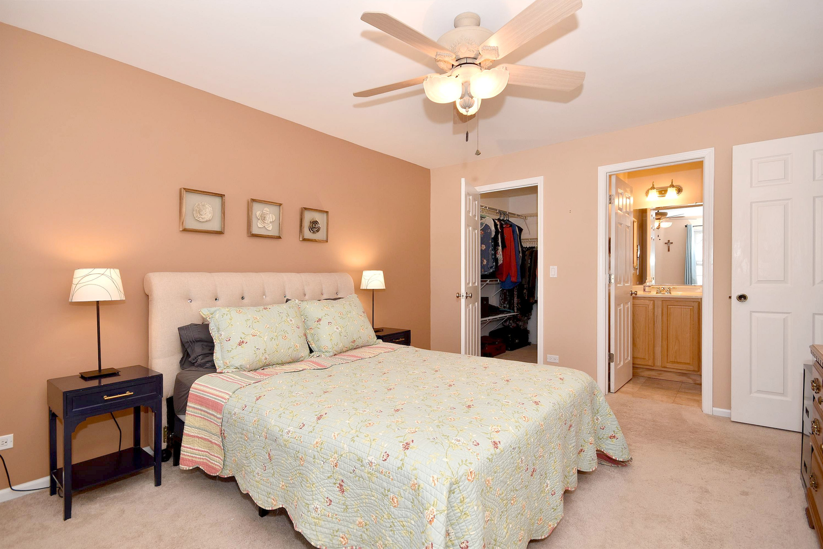 1622 Hadley Court, Unit C1 Wheeling, IL 60090 - Photo 12 of 32 a bedroom with a bed and a chandelier