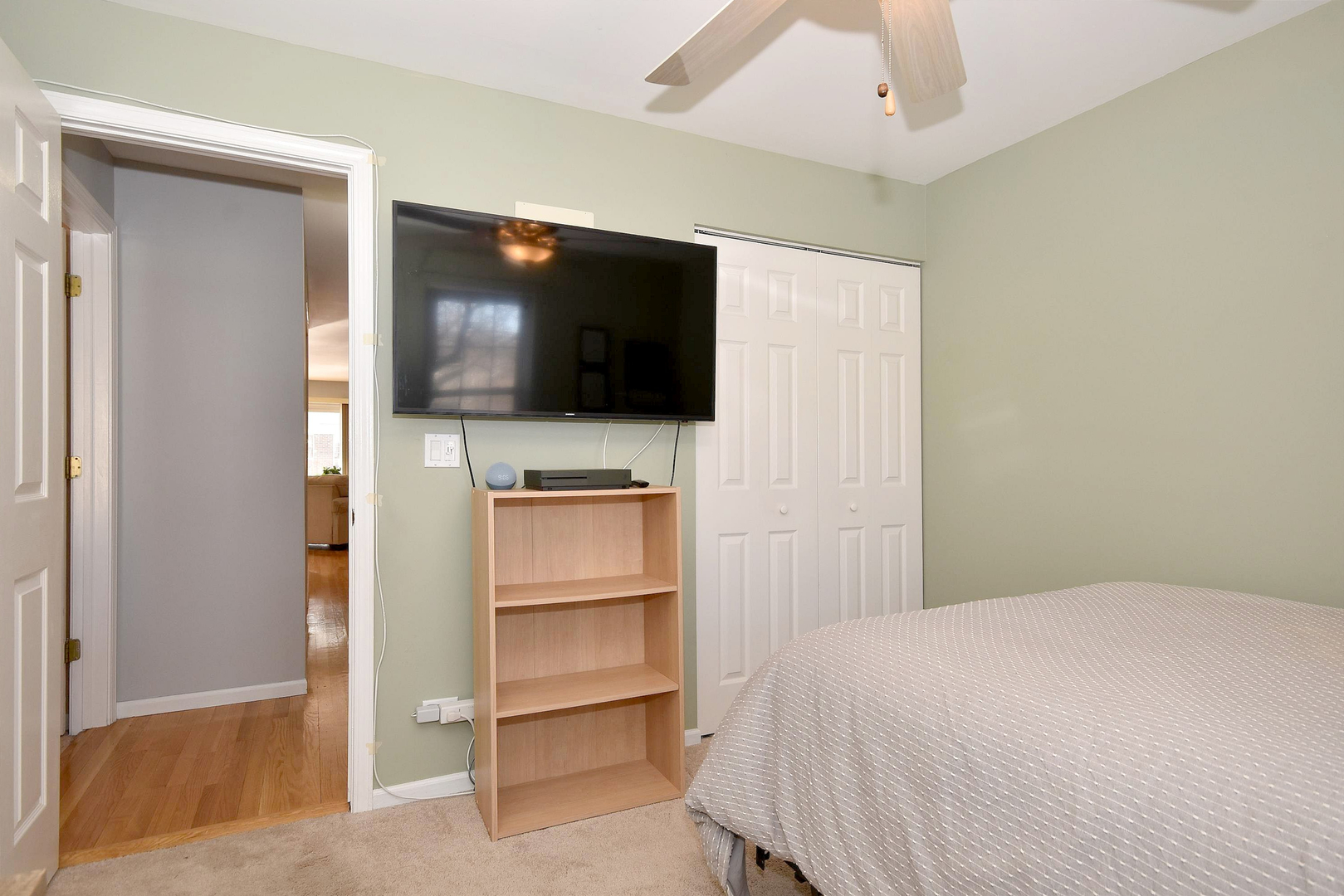 1622 Hadley Court, Unit C1 Wheeling, IL 60090 - Photo 16 of 32 a bedroom with a bed and a flat screen tv
