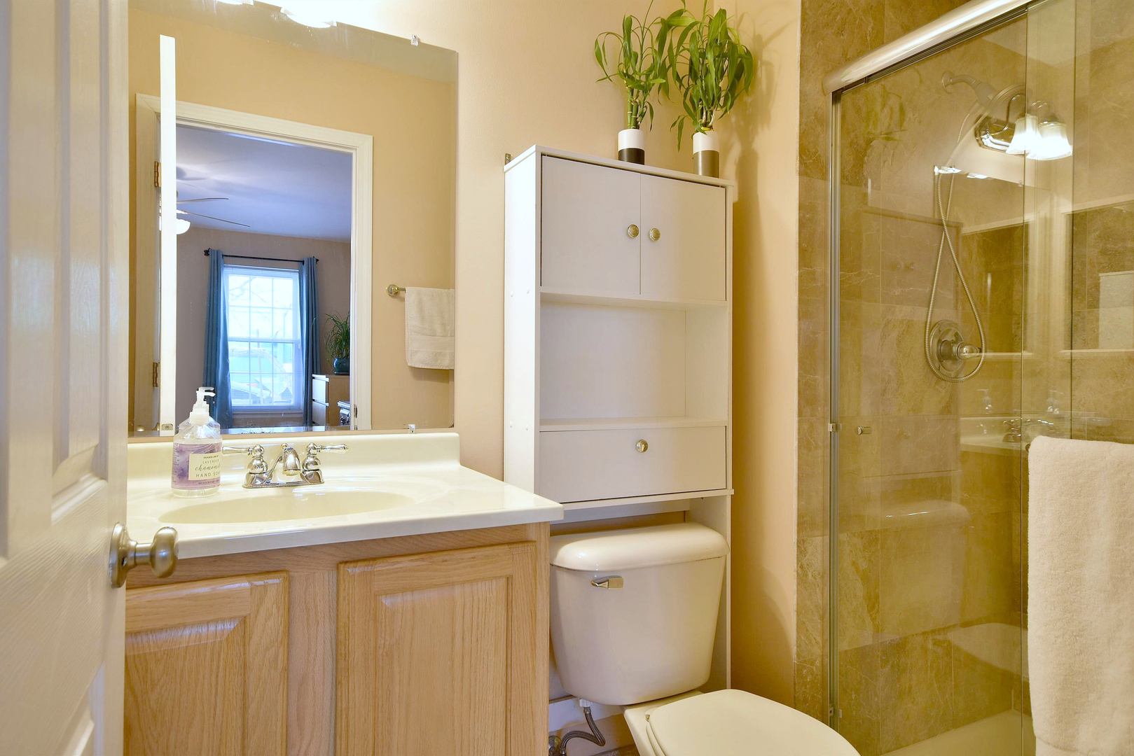 1622 Hadley Court, Unit C1 Wheeling, IL 60090 - Photo 20 of 32 a bathroom with a sink a toilet and shower
