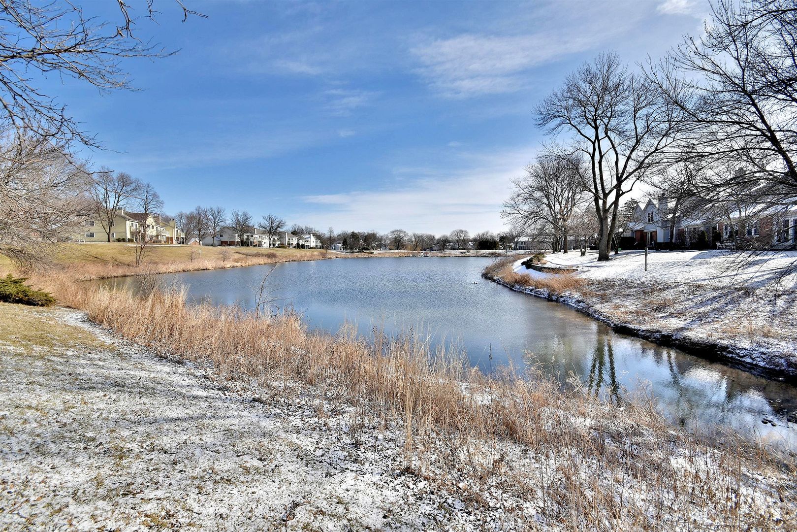 1622 Hadley Court, Unit C1 Wheeling, IL 60090 - Photo 29 of 32 a view of a lake with houses