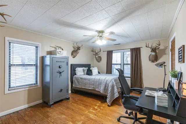 a bedroom with bed and window