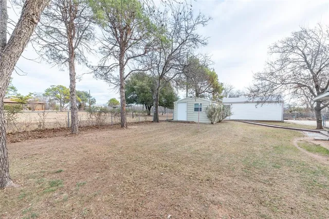 a view of a outdoor space with large trees