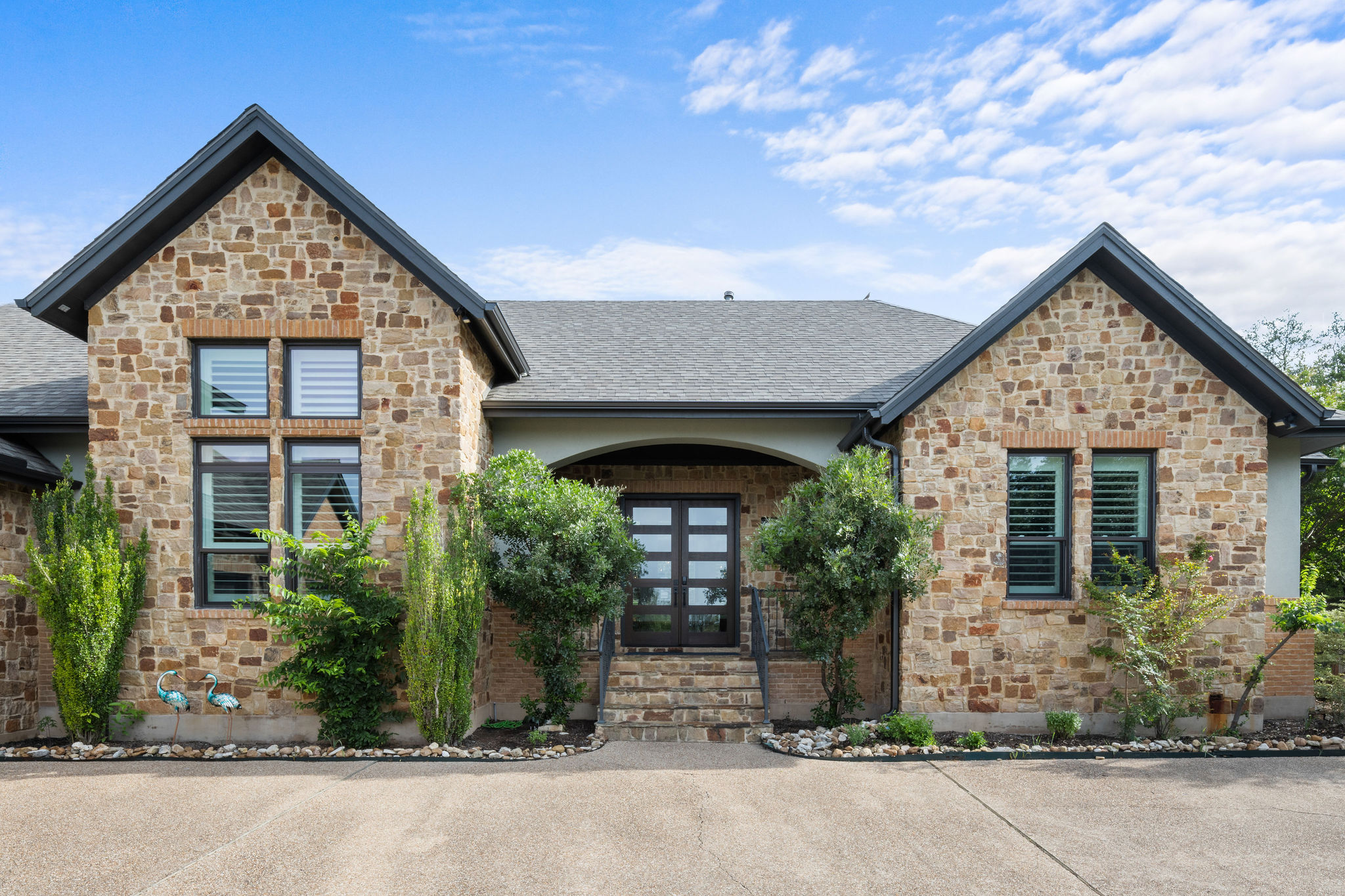 279 Rugged Earth Drive Austin, TX 78737 - Photo 3 of 40 View of front of property with stone siding and a shingled roof