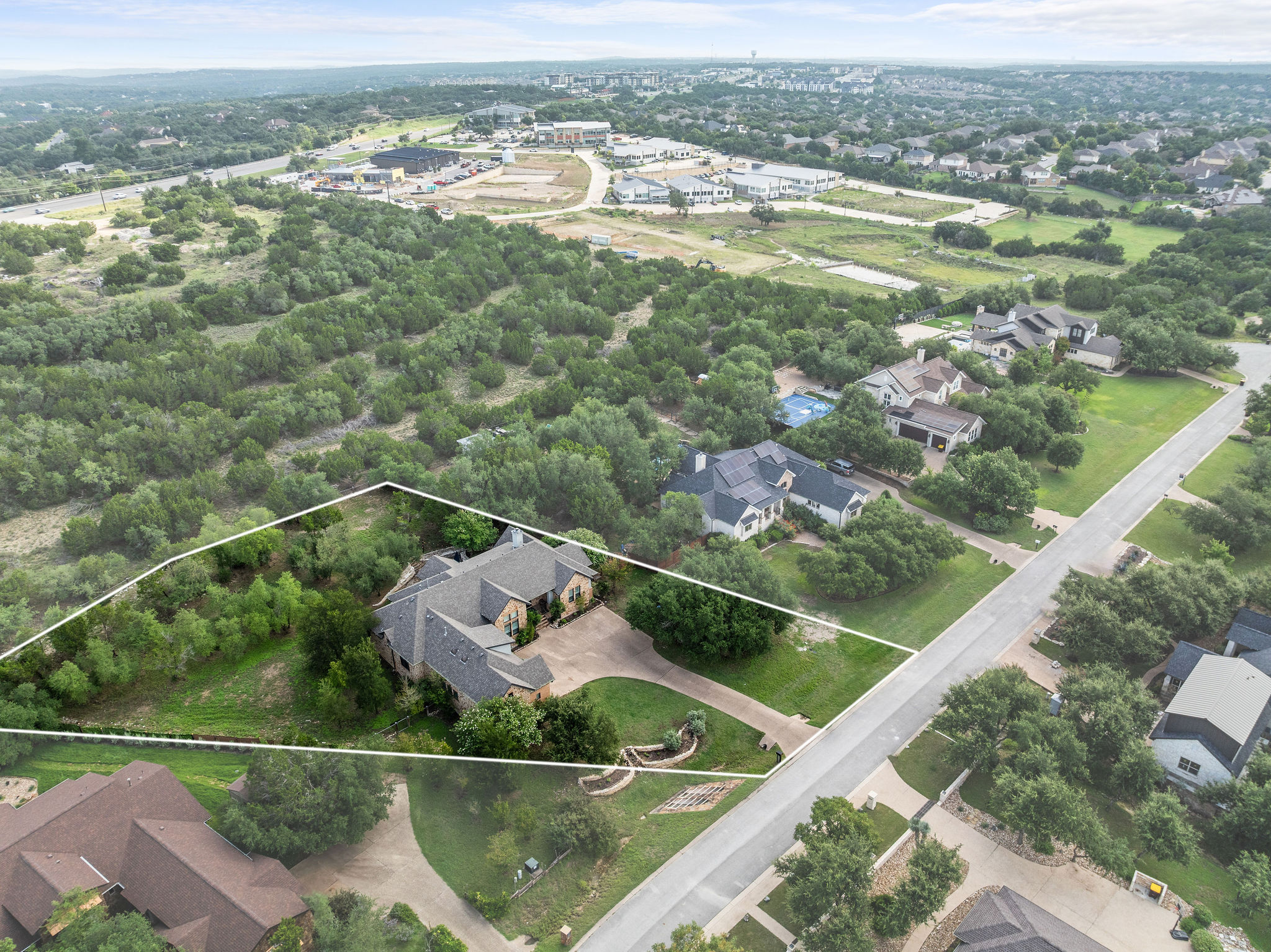 279 Rugged Earth Drive Austin, TX 78737 - Photo 40 of 40 Aerial view of residential area featuring property parcel outlined