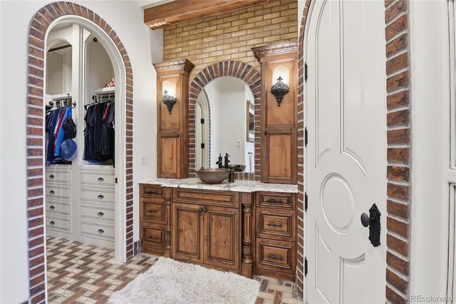 a view of a bathroom with a granite countertop sink and a mirror