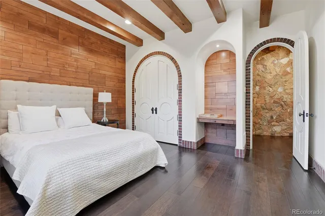 a bedroom with bed and a closet