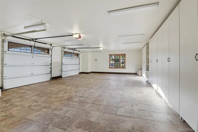 a front view of a house with a yard fire pit and outdoor seating