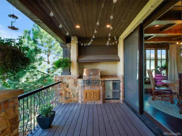 a view of a patio with a table and chairs