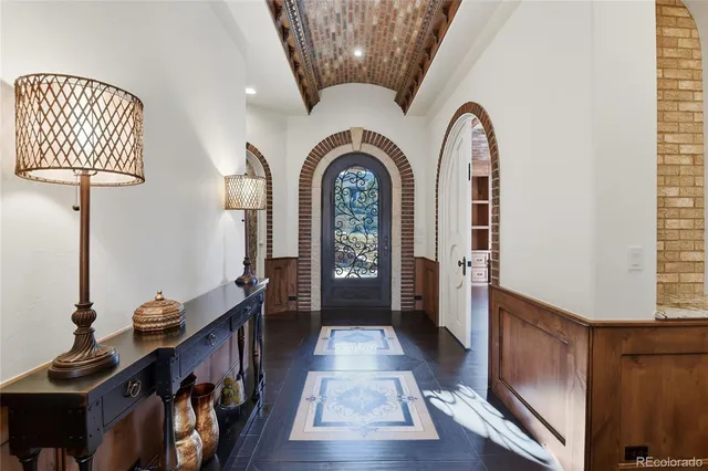 a view of hall way with furniture