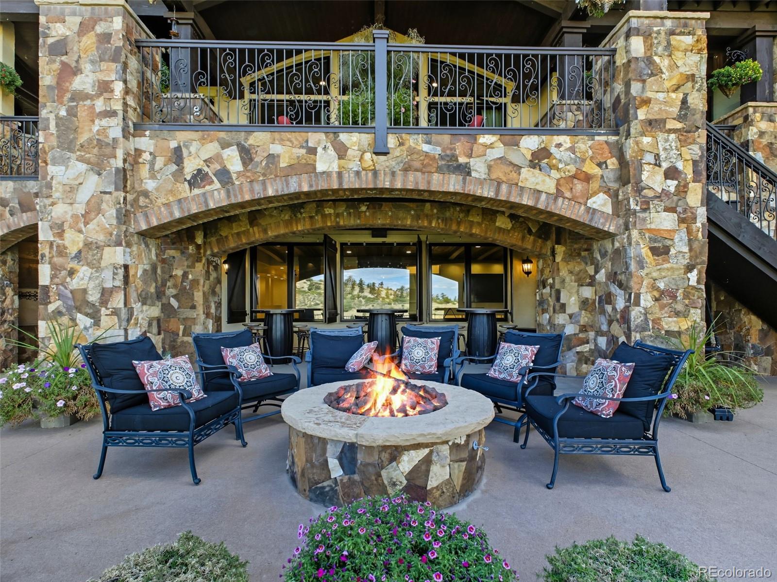7188 Raphael Lane Littleton, CO 80125 - Photo 41 of 46 a view of a patio with a table and chairs