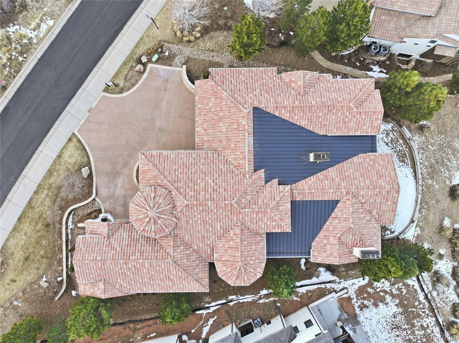 7188 Raphael Lane Littleton, CO 80125 - Photo 44 of 46 an aerial view of a house with garden space and street view
