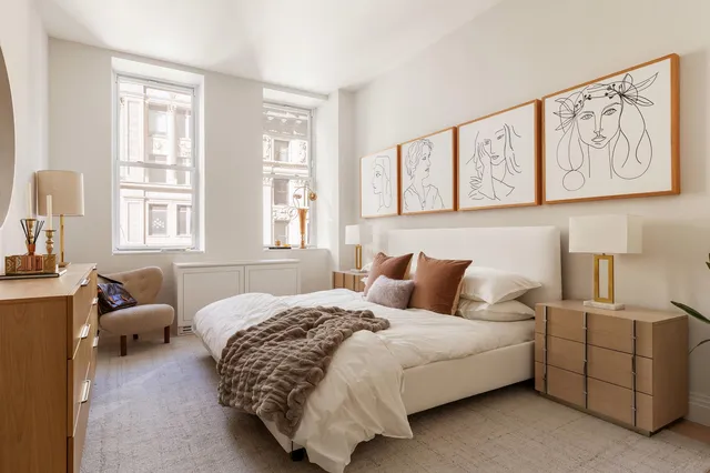 a kitchen with stainless steel appliances granite countertop a stove and white cabinets