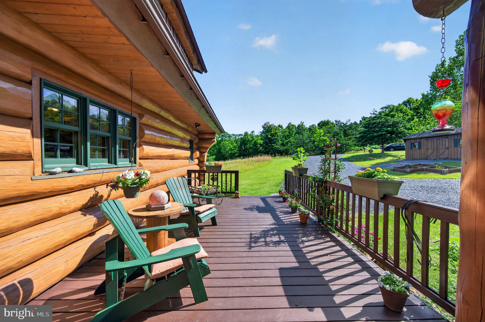 2199 Cheyennes Trail Gerrardstown, WV 25420 - Photo 45 of 63 Charming log cabin deck with nature views.