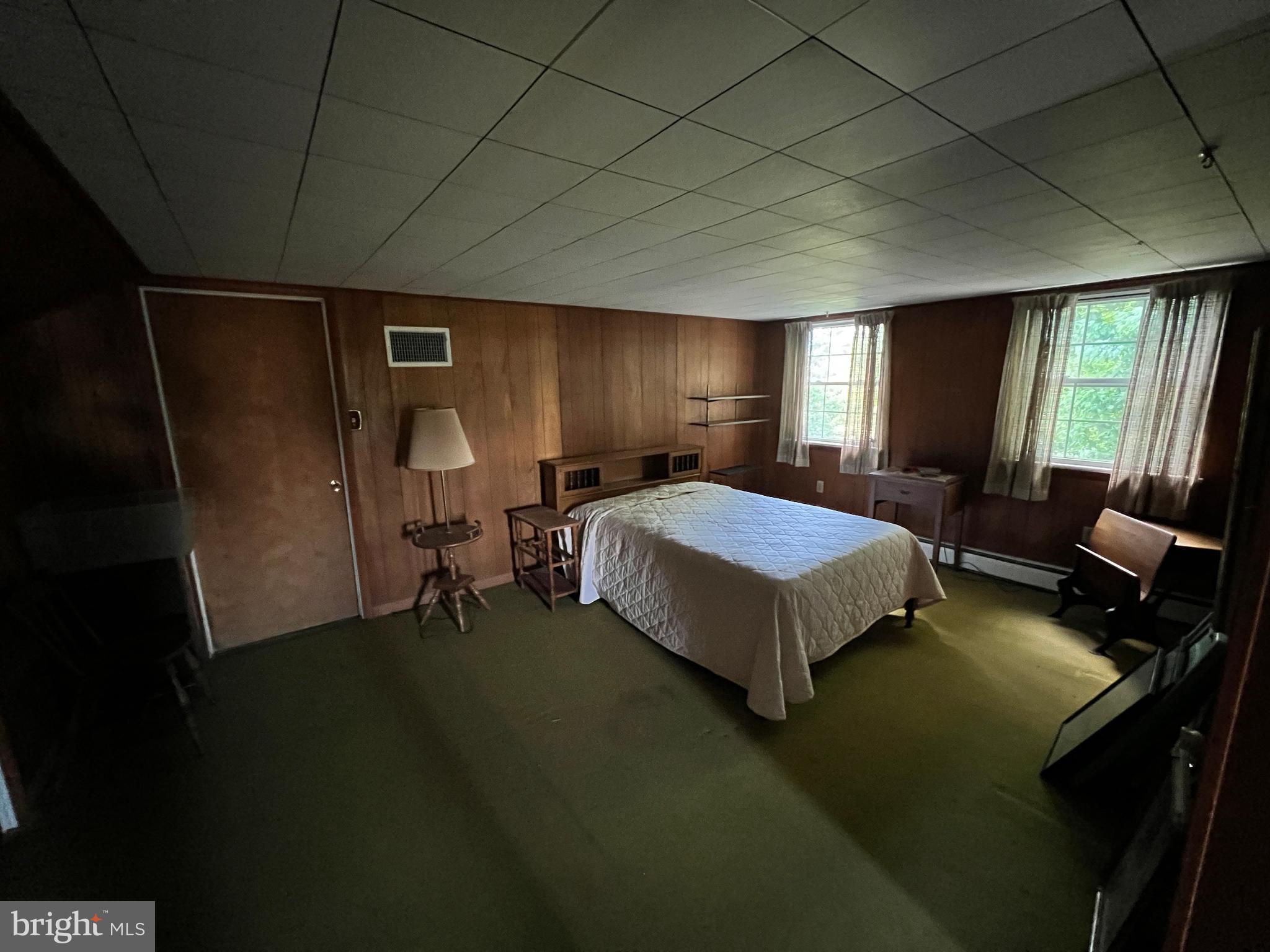 252 Doe Run Road Manheim, PA 17545 - Photo 15 of 32 a spacious bedroom with a bed and a couch