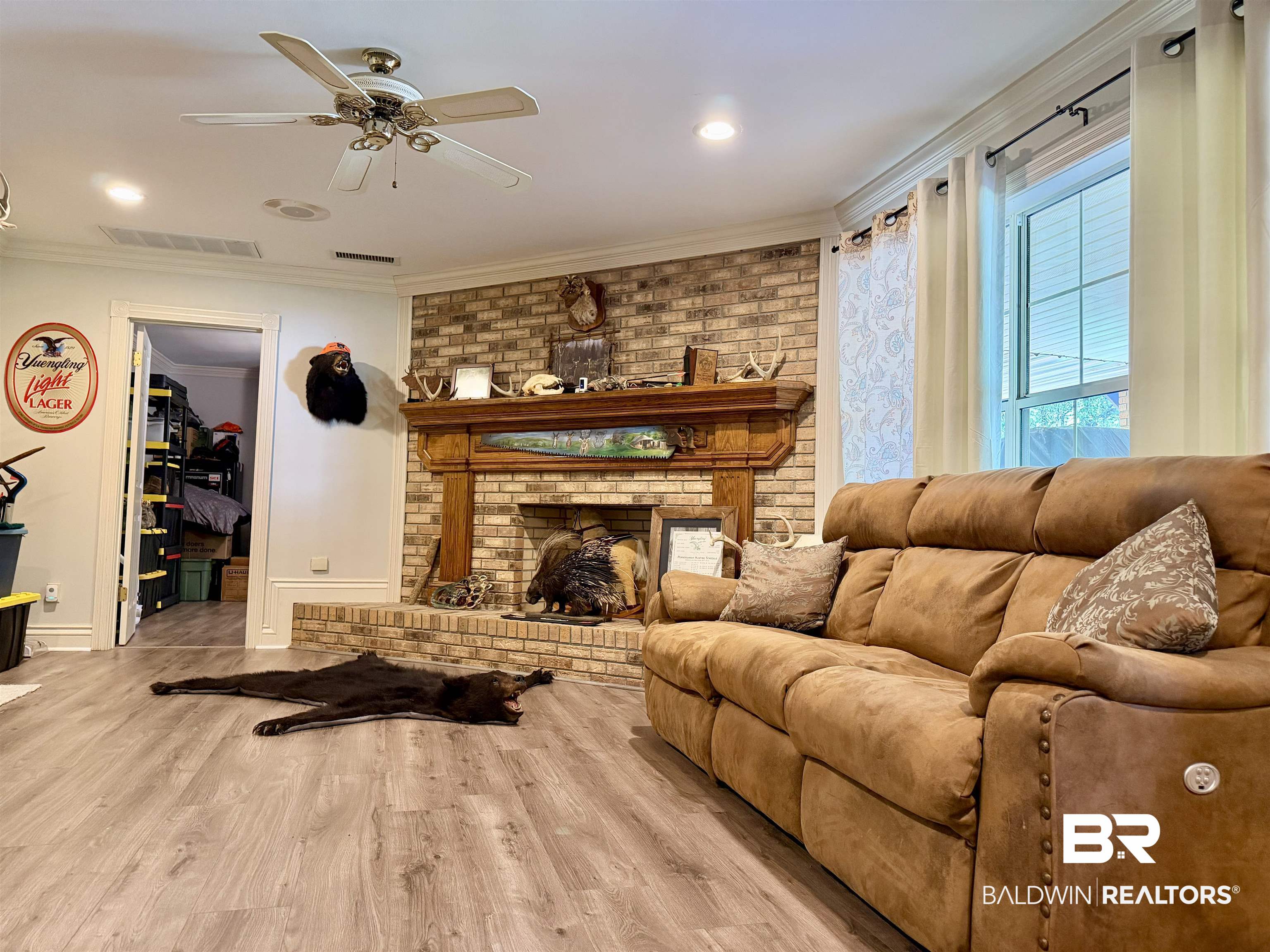 2944 Appleton Road Brewton, AL 36426 - Photo 40 of 65 Living room with light wood-style flooring, crown molding, ceiling fan, a fireplace, and recessed lighting