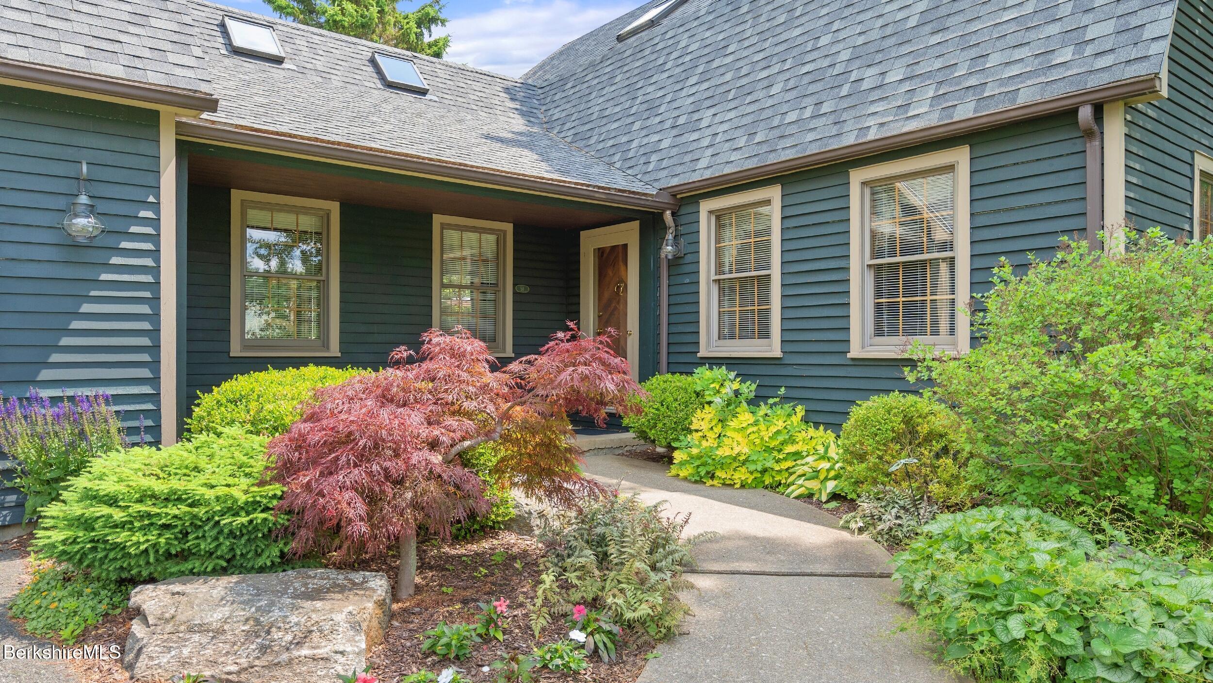 a front view of a house with an outdoor space