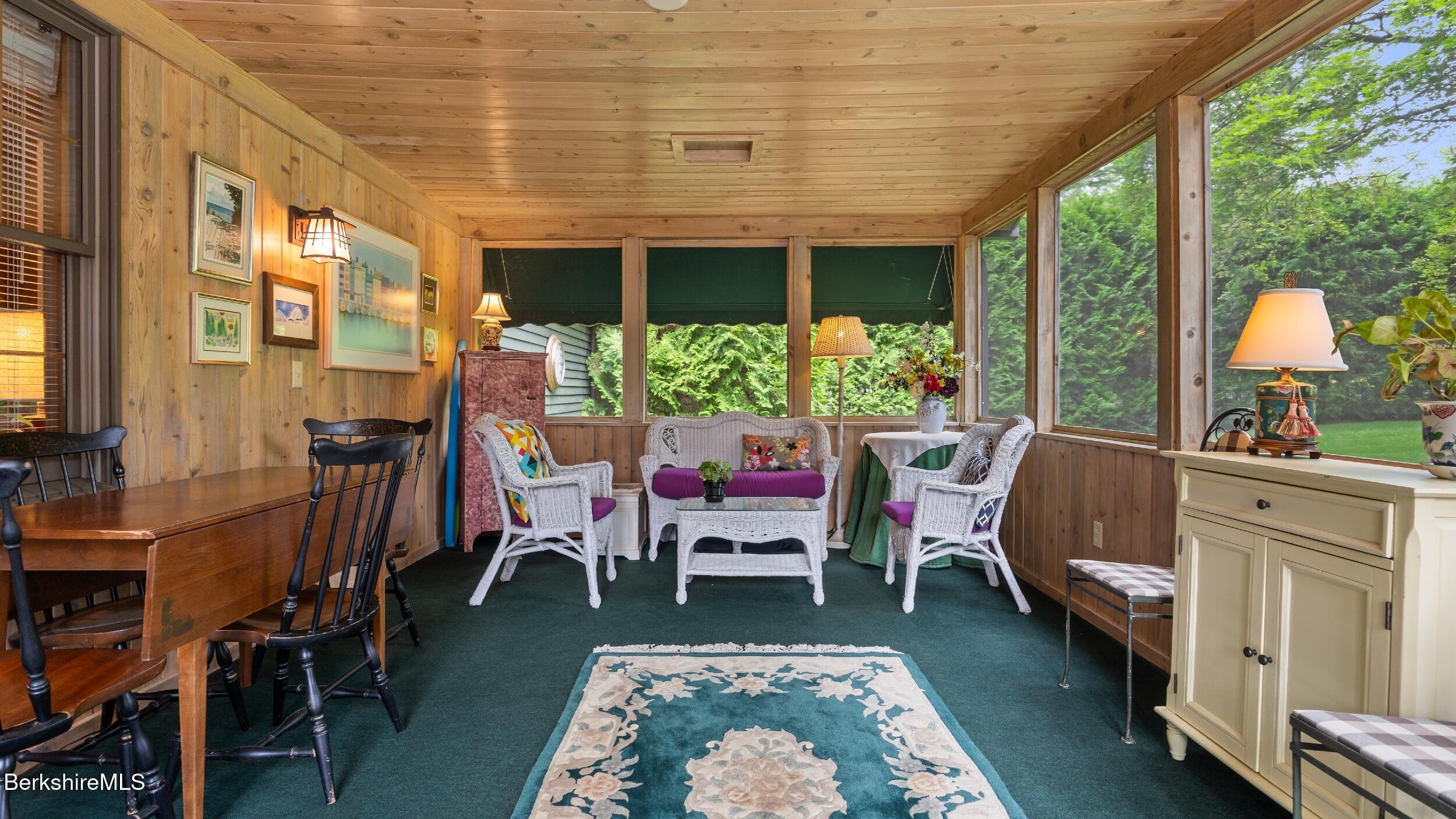 51 New Lenox Road Lenox, MA 01240 - Photo 11 of 38 a living room with furniture and a large window