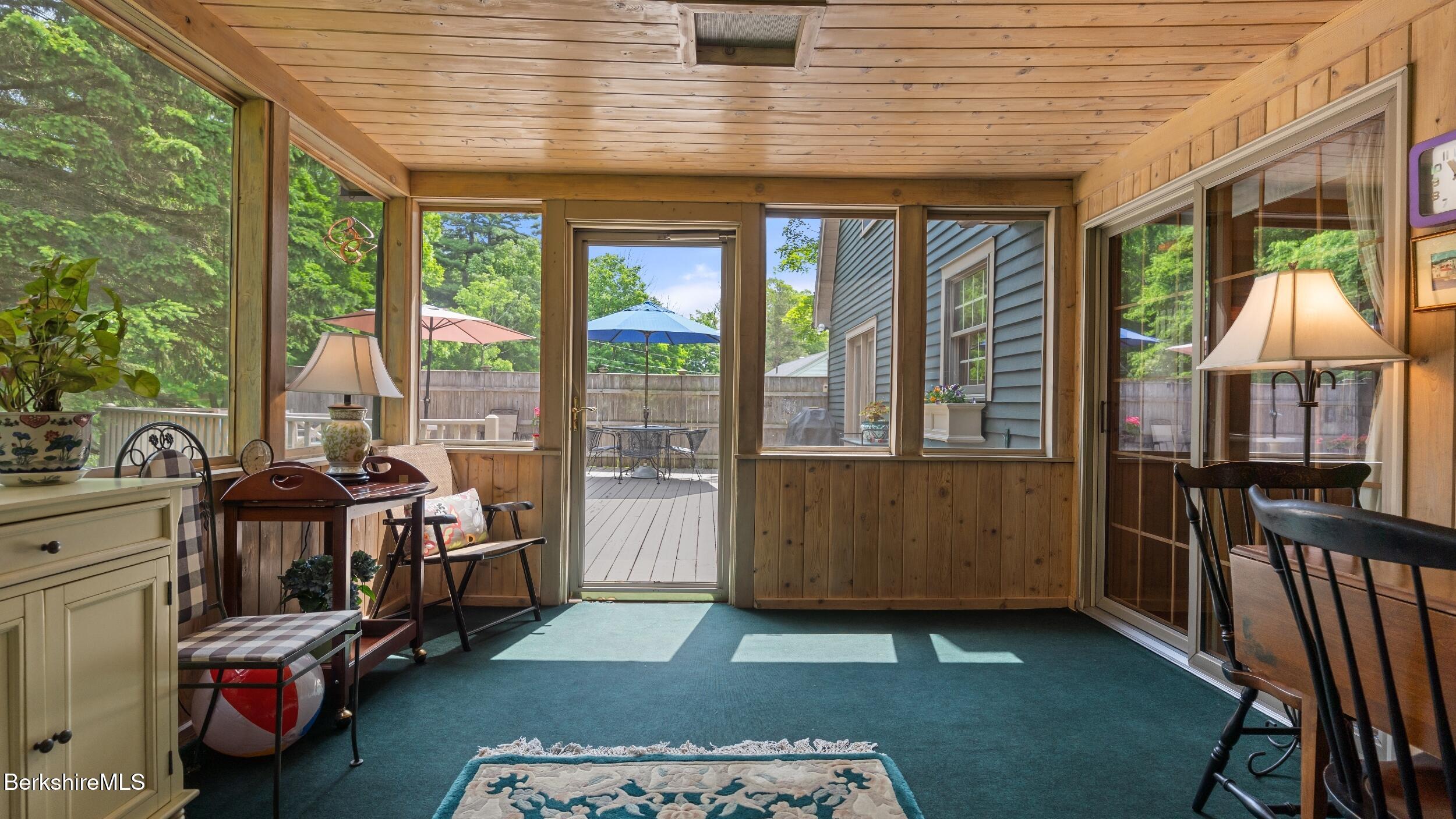 51 New Lenox Road Lenox, MA 01240 - Photo 13 of 38 a living room with furniture and a floor to ceiling window