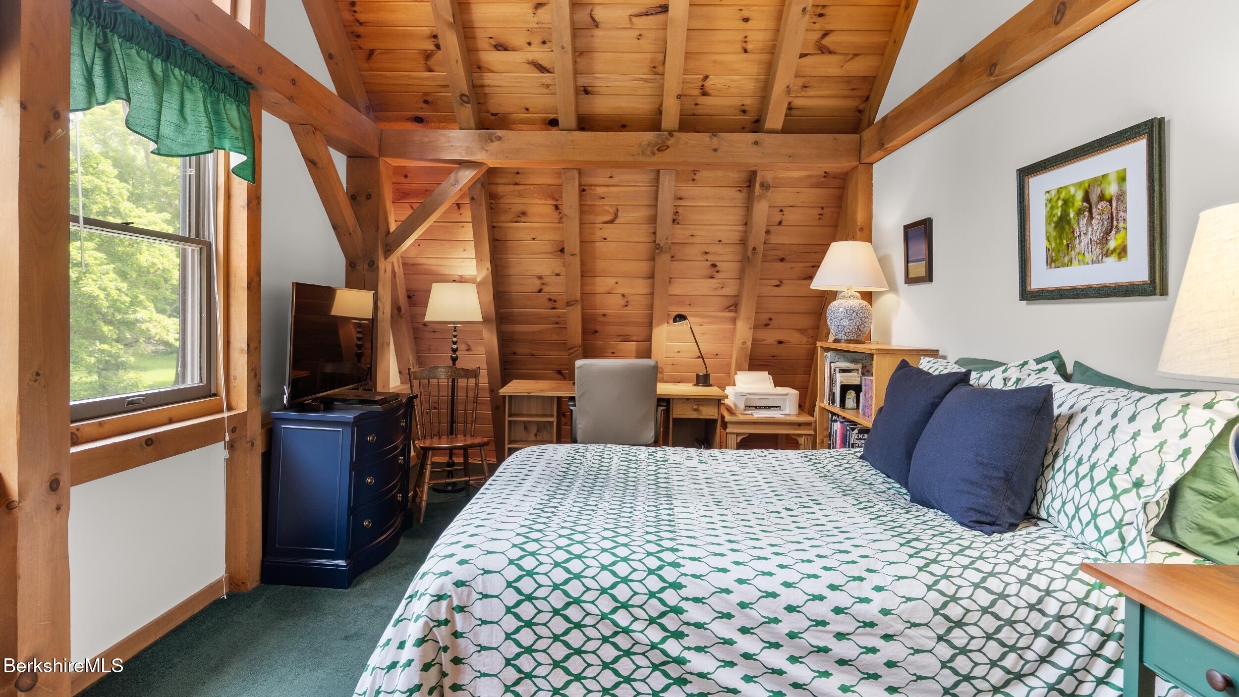 51 New Lenox Road Lenox, MA 01240 - Photo 18 of 38 a bed room with a bed and wooden floor