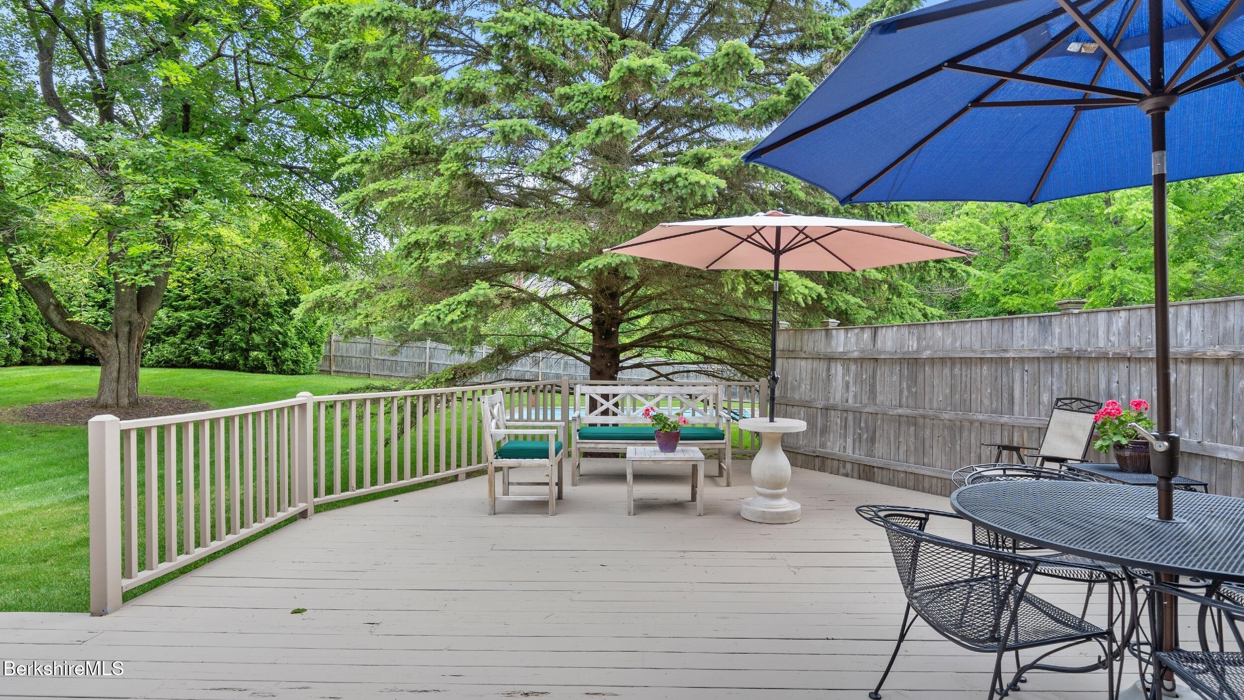 51 New Lenox Road Lenox, MA 01240 - Photo 29 of 38 a view of a patio with furniture and umbrella