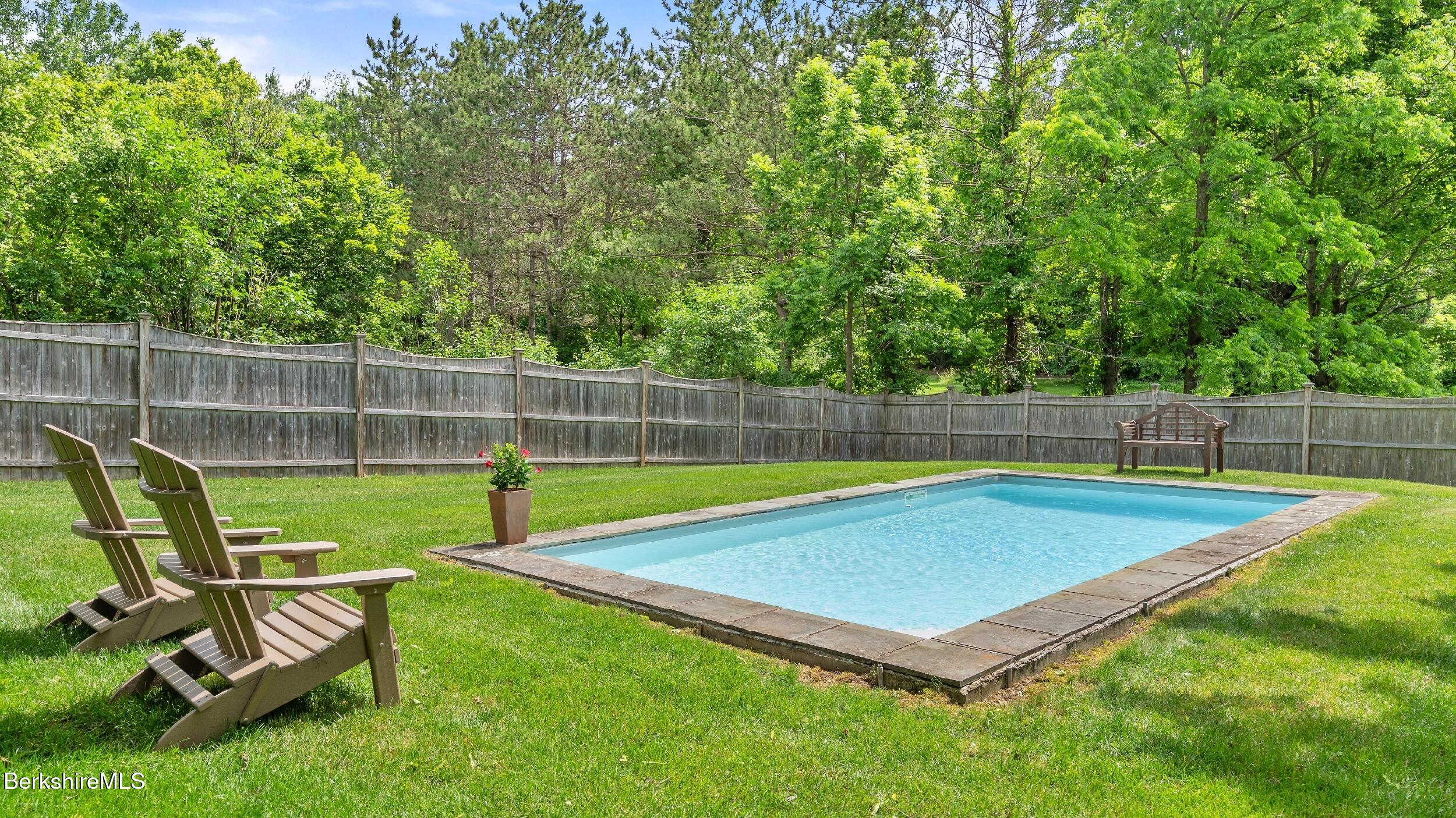 51 New Lenox Road Lenox, MA 01240 - Photo 3 of 38 a view of a backyard with a chair and swimming pool