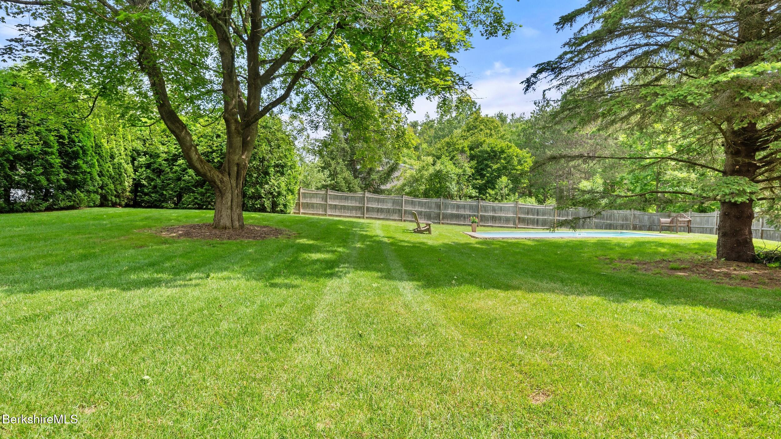 51 New Lenox Road Lenox, MA 01240 - Photo 32 of 38 a swimming pool with trees in the background